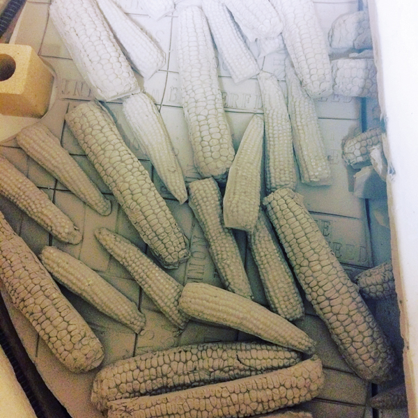 2 Greenware, press-molded corn cobs by Susan Day in the kiln for a bisque firing. 