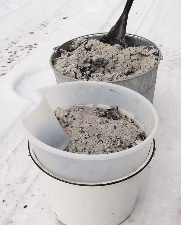 2 Once the ash is cold, sieve and discard any debris. Collect the ash in a plastic bucket for rinsing with water.