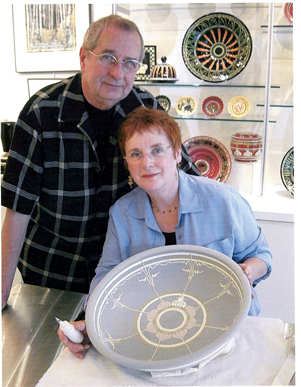 2 Tyrone and Julie Larson with decoration in progress on a pasta bowl, 18 in. (46 cm) in diameter, 2005.