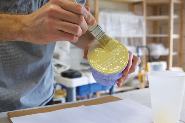 1 Apply wood glue to the base of the fired cup.