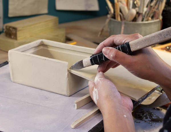 5 Carefully hold the lid slab against the short wall and mark the width between the two grooves. 1–5 Photos: Joshua W. Cotter.