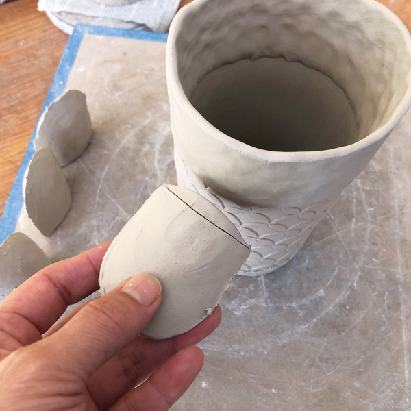 6 Cut the thimble’s open end to match the cup’s curve, then attach.