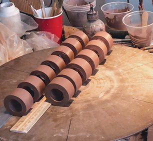 8 Measure and slice rings from a slip-cast (or thrown) cylinder to make handles.