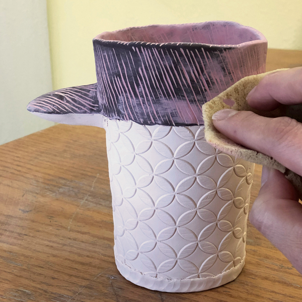 11 Sponge off the pink underglaze to accentuate the lines against the background.