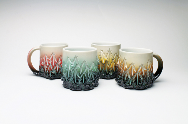 1 Dow Redcorn’s mugs, 4 in. (10 cm) in height, wheel-thrown and carved stoneware, underglazes, glaze, fired to cone 6 in an electric kiln. 