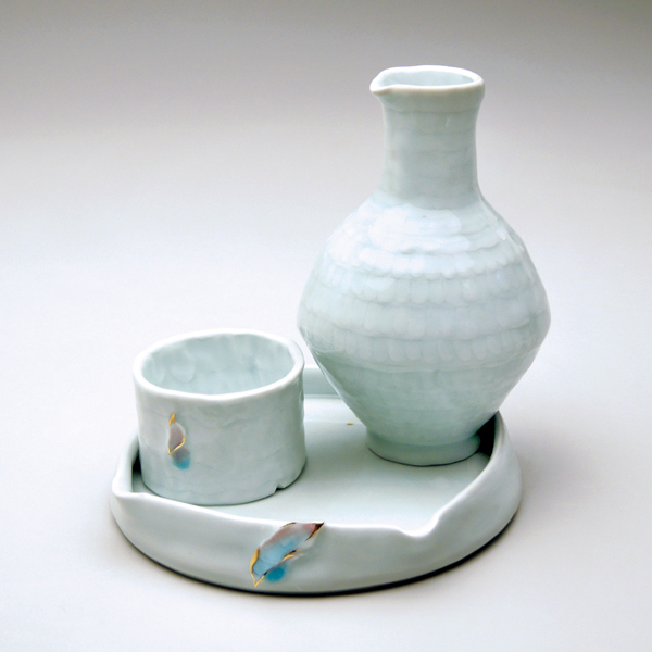  2 Yoonjee Kwak’s The Zen of Drinking Alone, 7½ in. (19 cm) in diameter, wheel-thrown and pinched porcelain, fired in reduction to cone 10 and cone 6, luster fired to cone 018.