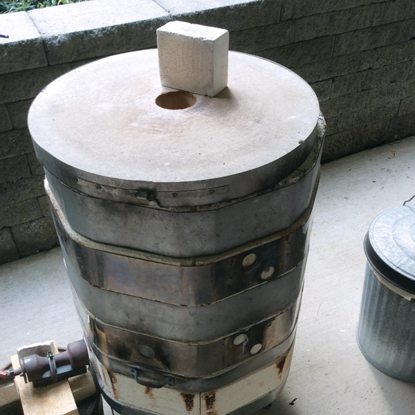 3 Kiln fully assembled showing lid with flue to draw the flame up and out of the kiln when firing. 