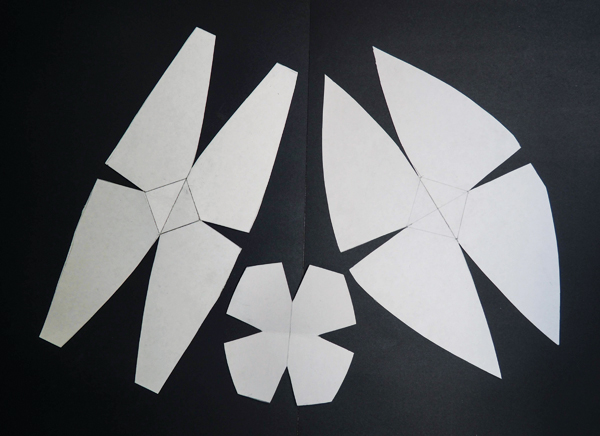 1 Explore variety in form by drawing and cutting out paper patterns from flat tag board.