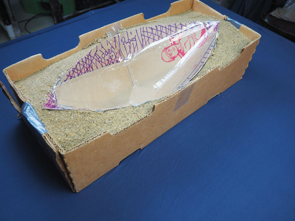 3 Reinforced paper pattern in a box that’s filled with sand. Note the paper added (purple lines) to the template to make a level edge.