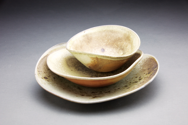 2 Deborah Heid’s soft bowls, to 11 in. (28 cm) in length, wheel-thrown and altered stoneware, shino glaze, wood fired in an anagama kiln to cone 10, 2018. Photo: Loren Maron.