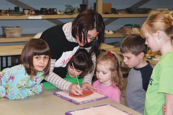 1 Lisa Bare Culp teaching a small private class for children at Bareclay