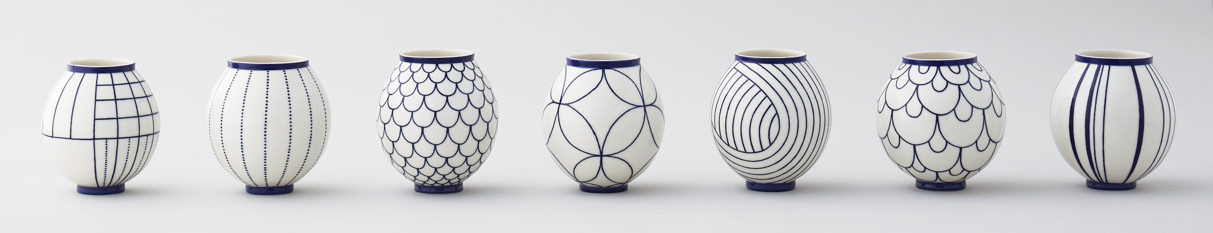 6 Moon jars, 4 in. (10 cm) in height, wheel-thrown and hand-painted porcelain. Photo: Yeshen Venema. 