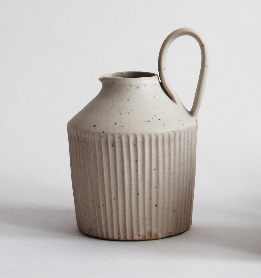 4 Mizuyo Yamashita’s tiny jug with handle, 7 in. (18 cm) in height, stoneware with various white glazes, 2011. 