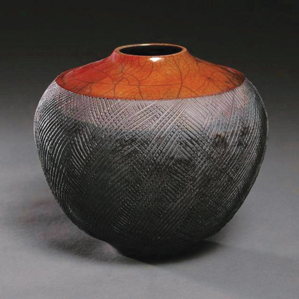 1 Tim Scull’s textured, wheel-thrown vessel, crackle glaze fumed with mineral salts of iron, raku fired.