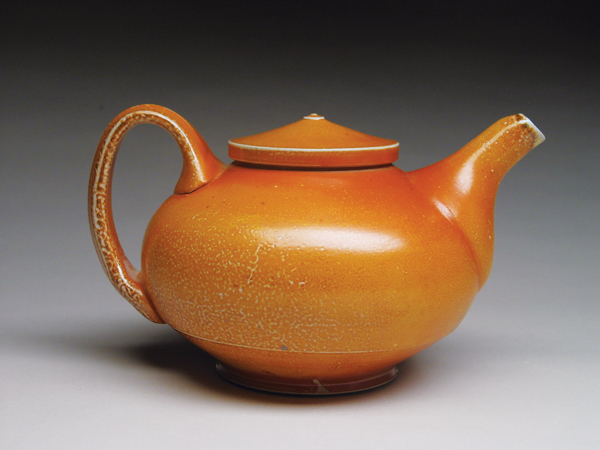1 Tyler Gulden’s teapot, 8 in. (20 cm) in width, wheel-thrown porcelain, flashing slip, salt and soda fired.