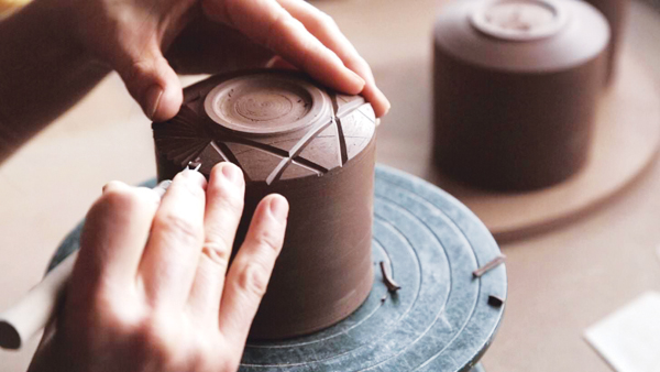 3 Carving the bottom design on Kiriko (cut glass design) cups using Japanese chisels for wood-panel printing, 2018. Photo: Nick MacMahon.