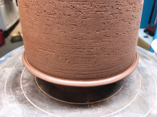 3 Add a coil near the base of the pot to act as a catch for the glaze.