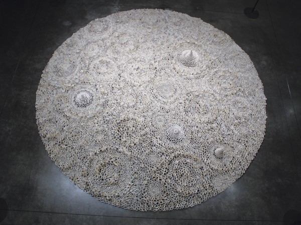 8 Jamie Bardsley’s Palm Prints (installed at The San Francisco Museum of Craft and Design), 10 ft. (3 m) in diameter, porcelain, fired in oxidation to cone 6, 2019.