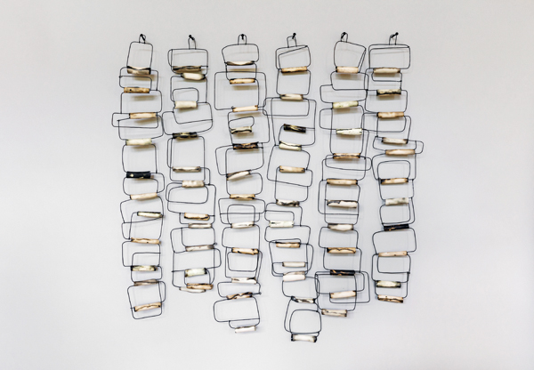 11 Karyn Gabriel’s Lineage, 4 ft. 2 in. (1.3 m) in width, handbuilt porcelain, oxide, fired to cone 6, blackened steel wire, 2019. Photo: Jason O’Rear.