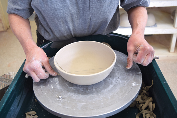 3 With a cutting wire, divide the third bowl in half as straight as possible.