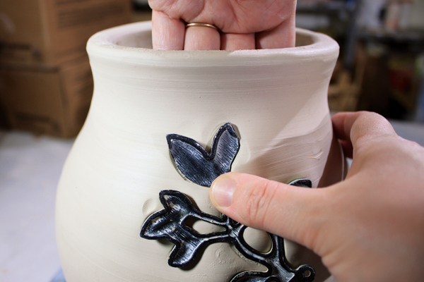 6 Begin to stamp the jar when the clay is just dry enough to no longer be tacky.