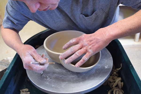 6 Place the cut bowl back in position and mark around it with a needle tool.