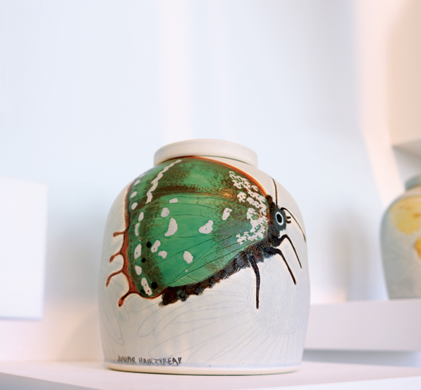 Juniper Hairstreak, 9 in. (23 cm) in height, wheel-thrown mid-range porcelain, carved, underglazes, soda fired, refired with china paint, 2019. Photo: Darrah Bowden.