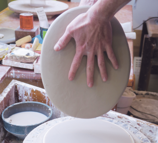 2 Begin stretching the slab, letting gravity help as you work your way around.