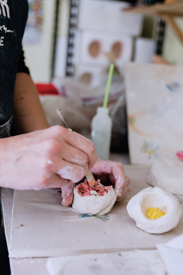 1 Add ceramic stains into small porcelain pinch pots.