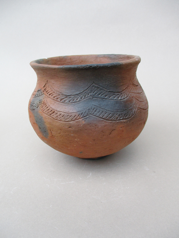 6 Eness Ngulube’s small pot, 6 in. (15 cm) in diameter, coil formed, scraped (likely with a mussel shell), etched (likely with a sharpened twig), pit fired.