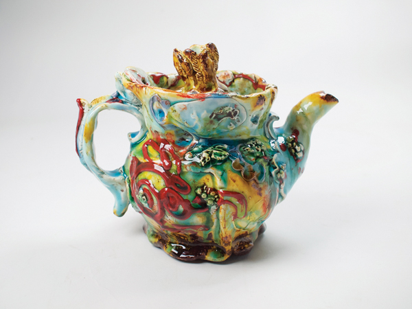 5 Lisa Orr’s teapot, 8 in. (20 cm) in width, earthenware, slips, sprigs, polychrome glazes, 2019.