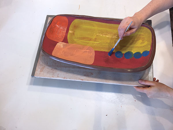 13 Apply contrasting colors of underglaze over top of it, to add depth to the surface. 