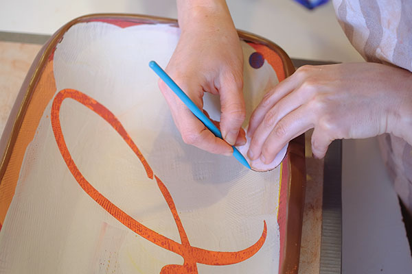 16 Add sgraffito lines, pressing just enough to carve through the top layer of slip.