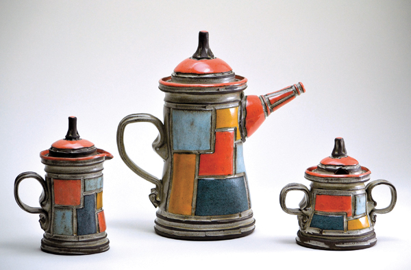 5 Patchwork tea set with creamer, sugar bowl, and teapot, dark brown stoneware, applied glazes.