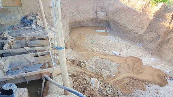 3 A clay pit in Lalejin. In areas with rich clay deposits, each family traditionally dug and dried their own clay. 