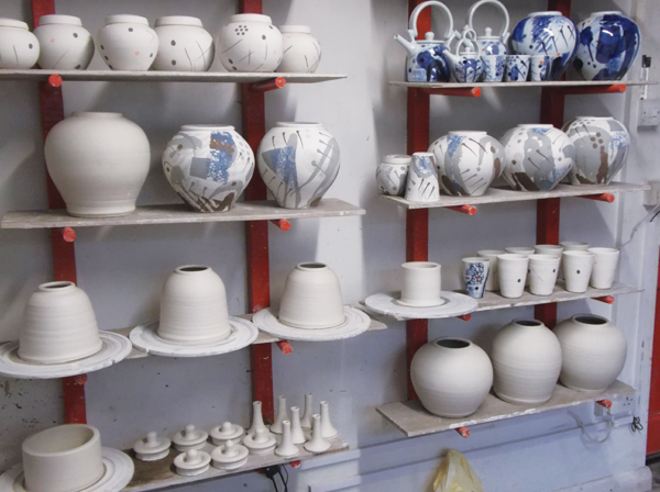 2 Various porcelain pieces in production: teapots, beakers, round lidded and small ginger jars. 