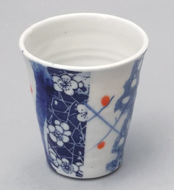 7 Beaker, 4 in. (10 cm) in height, Chinese decals, porcelain, blue underglaze slips, Cornish stone glaze, fired to cone 11 in reduction.