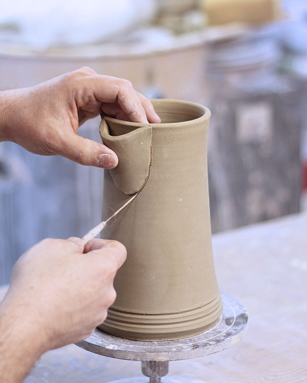 18 Hold the spout to the pot and trace along the outer edge, marking attachment points.