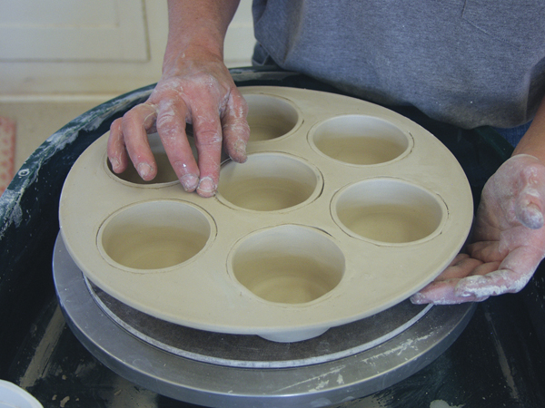 Fig 6 Flip the muffin pan over and carefully blend the edge of each cup into the top of the slab.