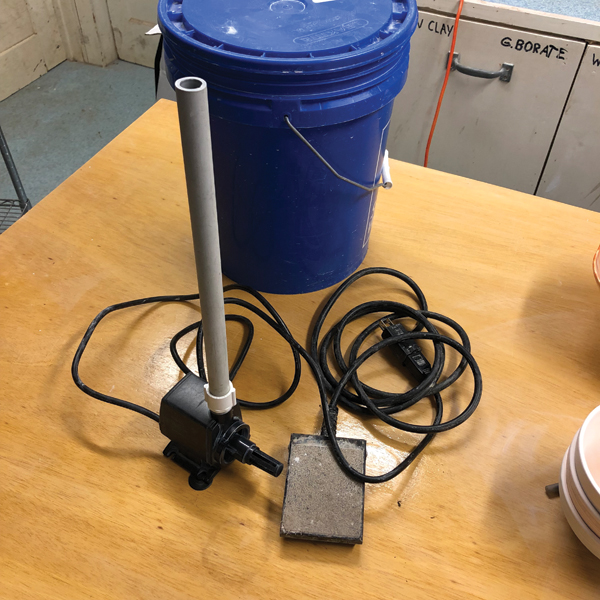 1 Main components of the glaze fountain, showing the water pump with PVC pipe attached and plugged into the foot-switch pedal.