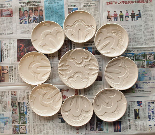 4 Ailynda Ho’s lunch plates, carved B-Mix clay, fired to cone 6 in oxidation.