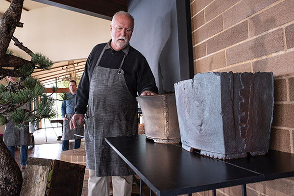 7 Ron Lang presents two bonsai container options for Ryan Neil’s Limber Pine at the LAB Session 2. Photo: Timothy Aguero for the Pacific Bonsai Museum.