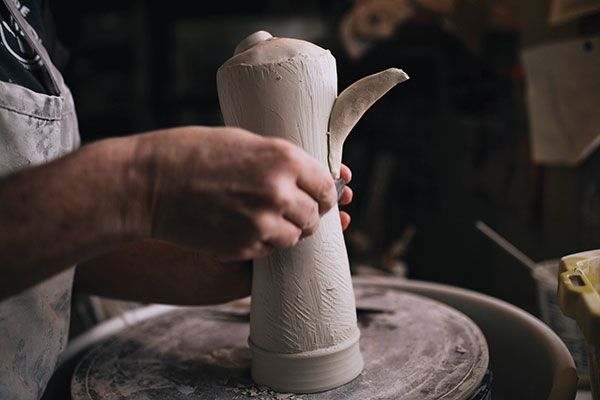 10 Attach the spout, smooth the cylinder, then wipe the form with a damp sponge.