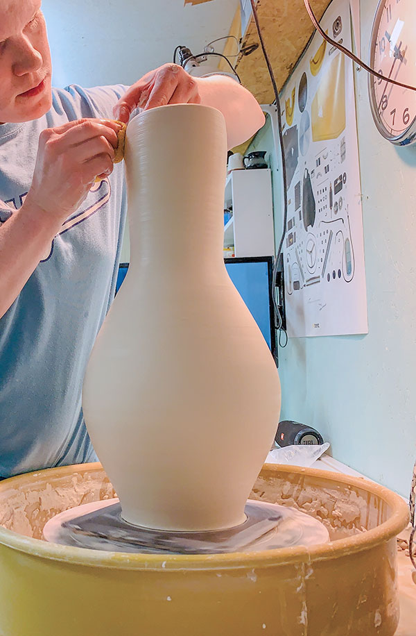 2 Throw the neck and belly together to create a seamless finished vase shape.