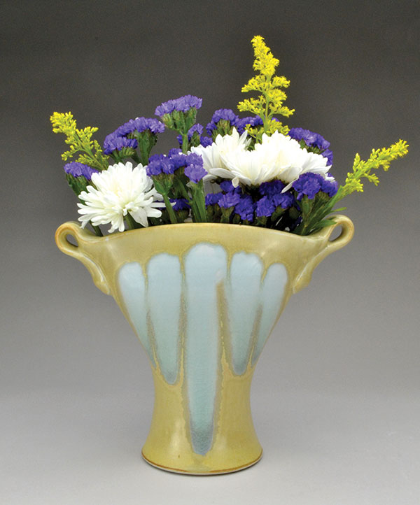 12 Blue and gold vase with handles, porcelain, fired to cone 10 in reduction, 2019. 
