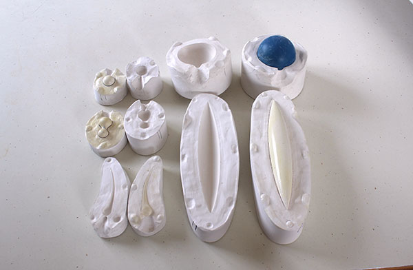 3 The plaster molds of each prototype are used to make multiple cast-clay copies.