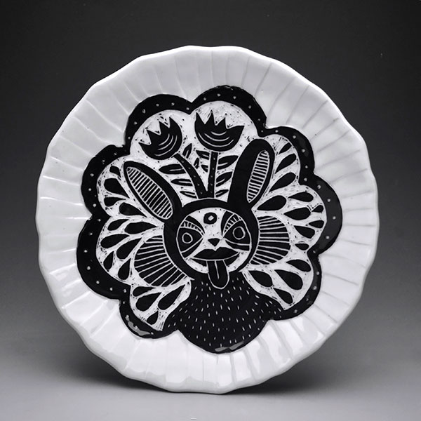 5 Jen Allen and Bryn Perrott’s Bat Plate, 10 in. (25 cm) in diameter, porcelain, black underglaze, fired to cone 10 in reduction, 2018.