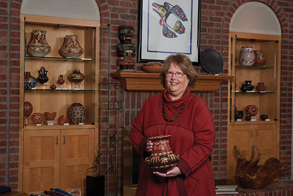 1 Jill Giller holding a large clay water jar by Russell Sanchez (San Ildefonso).