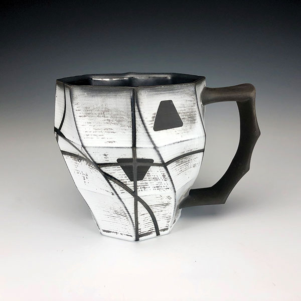 4 Curt Hammerly and Eric Heerspink’s collaborative mug, 4 1/2 in. (12 cm) in height, black porcelain, terra sigillata, glaze, fired to cone 5 in an electric kiln, 2019.