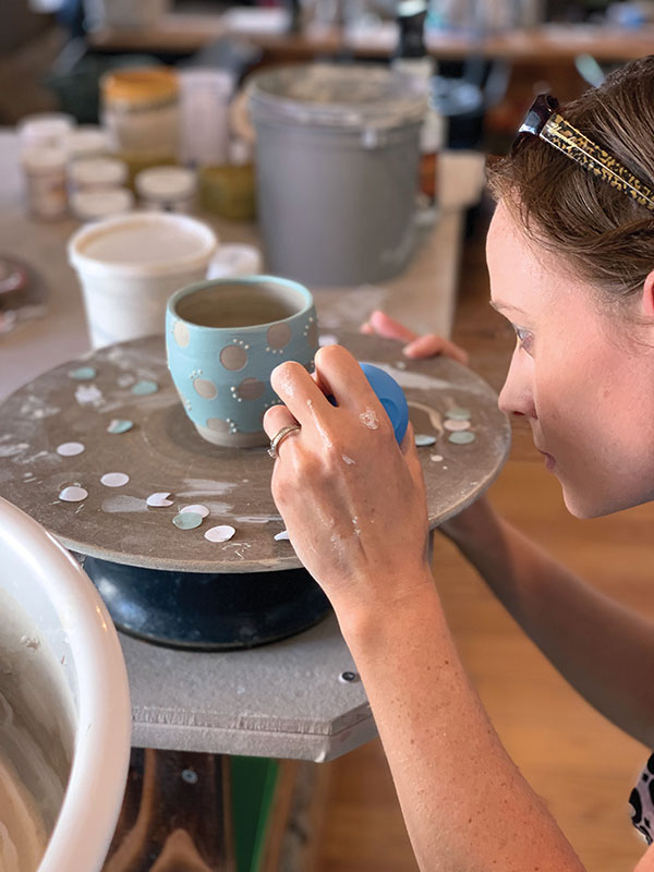 4 Participant Jackie Geiple slip trailing during Kristen Kieffer’s “Altered & Ornamented” workshop at Mud Queen Pottery, Harrisburg, Pennsylvania, September 6–8, 2019. Photo: Audra Masloff Doughty, Mud Queen Founder and Co-owner.